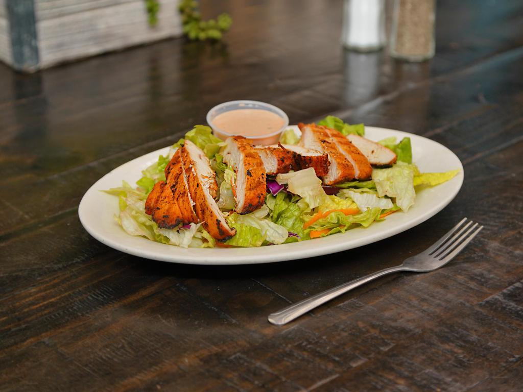 Grilled Chicken Salad · Our own grilled chicken breast served atop of a bed of fresh tossed salad and accompanied by our spicy house dressing or your choice of dressing. Boneless, skinless breasts of chicken marinated in Papa’s secret marinade.