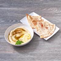 Hummus · Pureed chickpeas with tahini, fresh lemon juice and garlic.