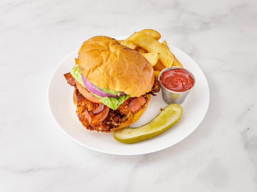 Crispy Chicken Sandwich · Breaded chicken, avocado, bacon, lettuce, tomato, and chipotle mayo. Served with french fries.