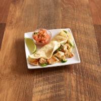 Charbroiled Chicken Taco · Served with onions, cilantro, and salsa ranchera.