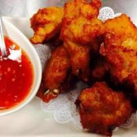 6. Crispy Wings · Chicken wings with flour and deep fried until crispy. Served with sweet chili sauce.