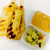 7. Chicken Satay · 4 skewers. Marinated chicken breast on wood skewers. Served with peanut sauce.