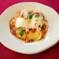 Cannelloni · Homemade cannelloni filled with ground beef, onions, mushrooms, ricotta and Parmesan cheese....