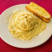 Fettuccini Alfredo · Fettuccini pasta with authentic Alfredo Sauce. Served with a side and garlic bread.