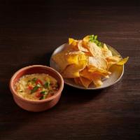 Queso Fundido · House creamy blend of cheese and jalapenos served with chips all freshly made, every single ...