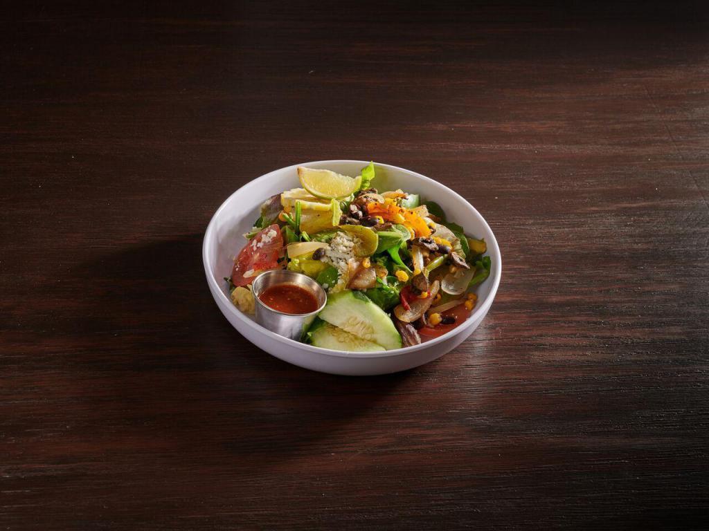 Charrito Fajita Salad · Mixed green lettuce with grilled veggies, cheese, onions, peppers, mushrooms, zucchinis, corn black bean, tomatoes, cucumber, avocado and sour cream. Add meat for an additional charge.
