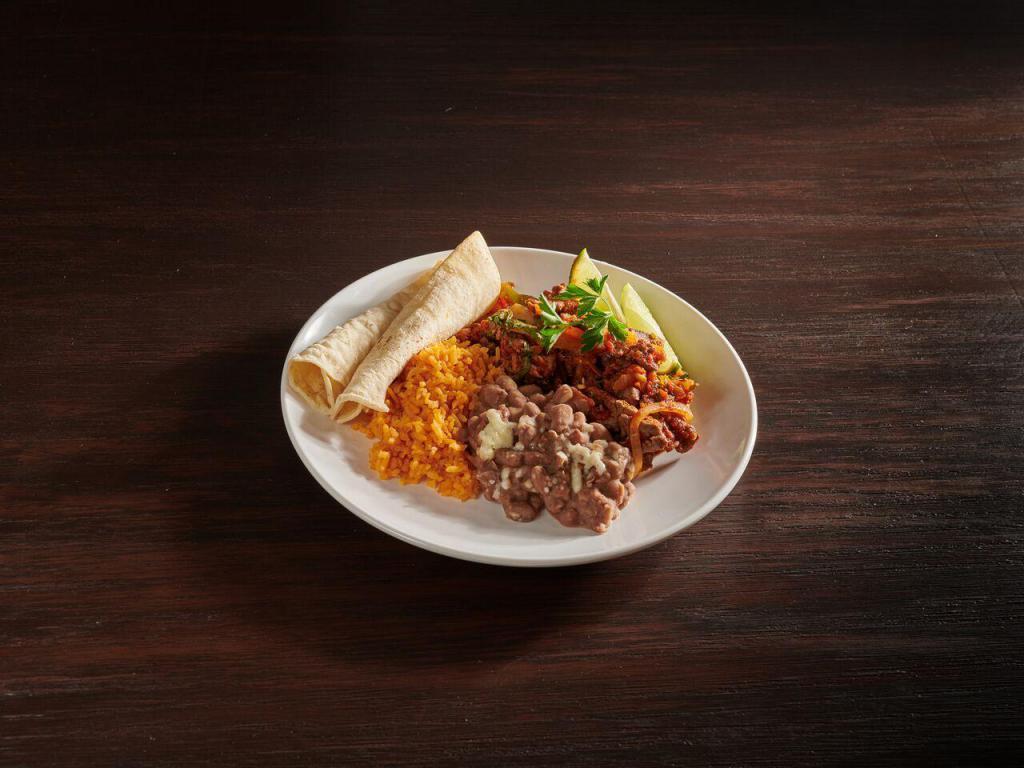 Steak A La Mexicana · Grilled sliced steak with bacon, peppers, onions, tomatoes, jalapenos.Served with rice and beans.