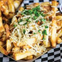 Garlic Fries · Fries tossed in fresh garlic and Parmesan cheese. Garnished with parsley.