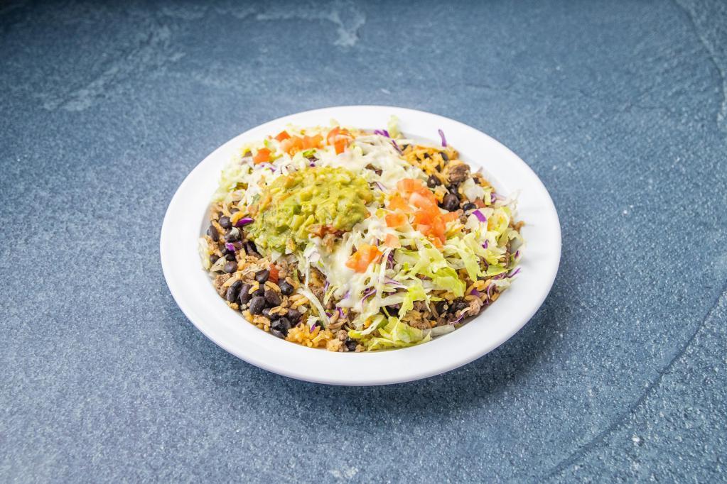 Burrito Bowl · Meat, black beans, rice, lettuce, tomato, cheese, sour cream and guacamole.