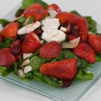 Strawberry Salad · Strawberries, dried cranberries and goat cheese on baby spinach topped with Parmesan cheese.