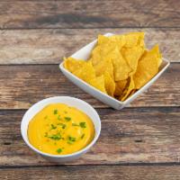 Con Queso Dip and Totopos · Cheese and salsa mixed (hot, mild or medium) with chips.