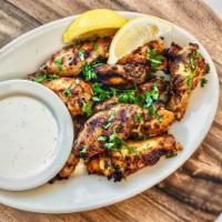 Flame Roasted Lemon Chicken Wings · Marinated for 24 hours then roasted to perfection in our brick ovens. Specify mild, spicy or...