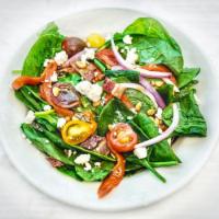 Spinach Salad · Comes with roasted red peppers, red onion, tomato, bacon, crumbled feta, toasted pine nuts. ...