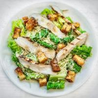Chicken Caesar Salad · Crisp romaine, sliced chicken breast, housemade croutons, freshly grated Parmesan. Served wi...