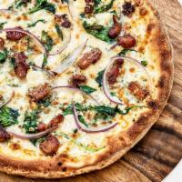 Trentino Pizza · Mozzarella, Parmesan, crumbled feta, baby spinach, red onions, pancetta, herbs, Meyer lemon ...