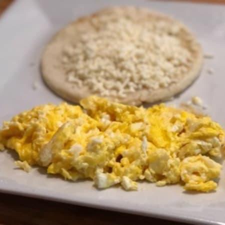 Huevos Pericos · Scrambled eggs, chopped onions and tomatoes.
All breakfasts are served with ‘arepa paisa’ topped with white cheese, hot chocolate or coffee!