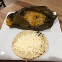 Tamales Breakfast · A corn “cake” filled with chicken, pork, potatoes, peas & carrots all wrapped in a banana le...