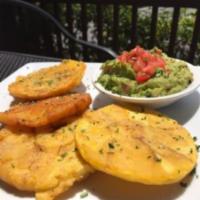 Patacon Con Guacamole · Fried green plantains lightly salted served with fresh guacamole.