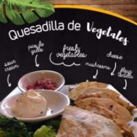 Quesadilla de Vegetales · Fresh vegetable, sauteed mushrooms, onions, peppers, mixed cheese, tomatoes and broccoli mix...