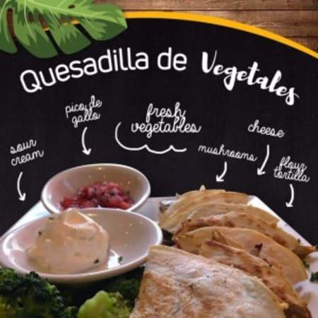 Quesadilla de Vegetales · Fresh vegetable, sauteed mushrooms, onions, peppers, mixed cheese, tomatoes and broccoli mixed in a grilled flour tortilla. Served with broccoli, pico de gallo and sour cream.