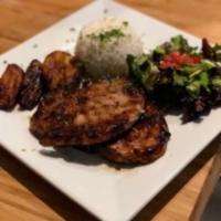 Chuleta al Grille · Grilled pork chop. Served with white rice, sweet plantains and salad.