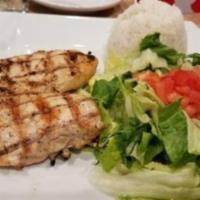 Pollo al Grill · Marinated wood grilled chicken breast (10oz.), served with white rice, beans and salad.