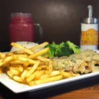 Pechuga con Champinones · Grilled chicken breast (10oz.), topped with our homemade mushroom sauce. Served with white r...