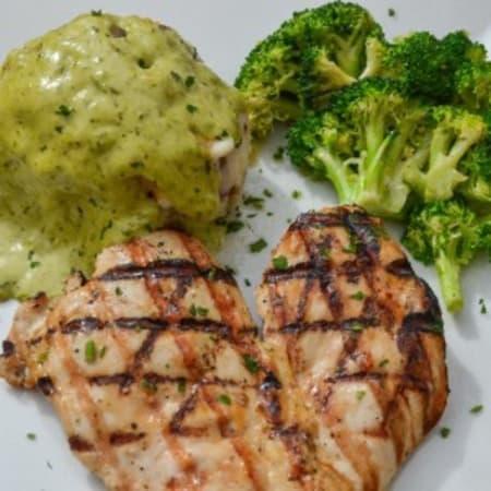 Pollo Con Salsa de Cilantro · Wood grilled chicken breast (10oz). Served with mashed potato loaded with corn and melted chesse, both topped with our homemade cilantro sauce and side of broccoli. Delicioso!