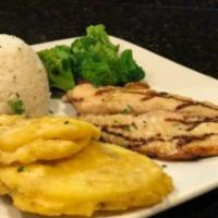 Filete de Tilapia · Includes your choice of grilled or fried tilapia fillet. Served with white rice, green plant...