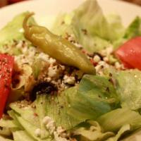 Greek Salad · Lettuce, tomato, feta cheese, black olives and pepperoncini with our herbal vinaigrette. Cal...