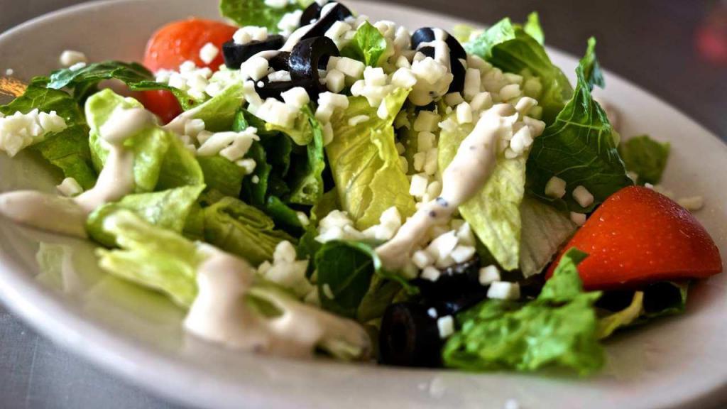 Garden Salad · Lettuce, tomato, mozzarella and black olives. Add grilled chicken strips for an additional charge.
