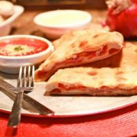 Calzone Classico · Mozzarella, ricotta, pepperoni and ham.