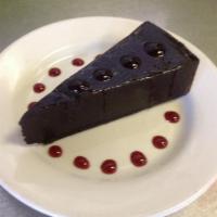 Chocolate Ganache Torte · Purely decadent chocolate ganache, highlighted with raspberry sauce. Gluten-free option avai...
