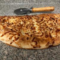 Buffalo Chicken Calzone · Three-Cheese Blend Italian Style Calzone With Buffalo Chicken Served with Side Of Blue Chees...