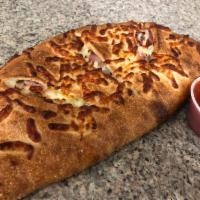 Meat Lovers Calzone · Three-Cheese Blend Italian Style Calzone With Ham, Pepperoni, Sausage and Side Of Our Homema...