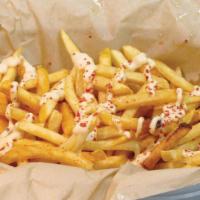 7. House Fries · Crispy French Fries with Cajun Seasoning. Served with Garlic Aioli Sauce.