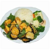 Tofu Eggplant · Tofu and eggplant stir-fried with basil and onion, served with rice and vegetables. Gluten f...