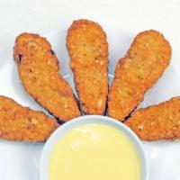 Golden Nuggets · Fried soy protein nuggets with vegan honey mustard sauce.