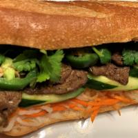 Banh Mi Sandwich · Lemongrass flavored soy protein slices, cucumber, pickles, jalapeno, cilantro in organic bau...