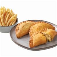 Empanada Trio Meal · Handmade Daily and Packed with Our Signature Chicken. Includes Choice of Side.