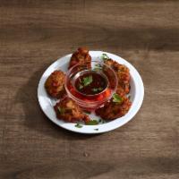 5 Mixed Vegetable Pakoras · Free style shape marinated in chickpea batter with deep-fried. Served with organic seasoning...