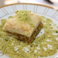 Traditional Baklava Pistachio · Fillo dough filled with pistachio nuts, drizzled with simple cane sugar syrup. With or witho...