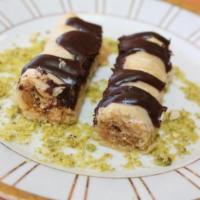 Choclava · Thin layers of fillo rolled and filled with crushed walnuts and chocolate.