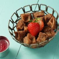 Churro Waffle Bites · Waffle-pressed churro with a choice of vegan Callebaut chocolate or strawberry dipping sauce...