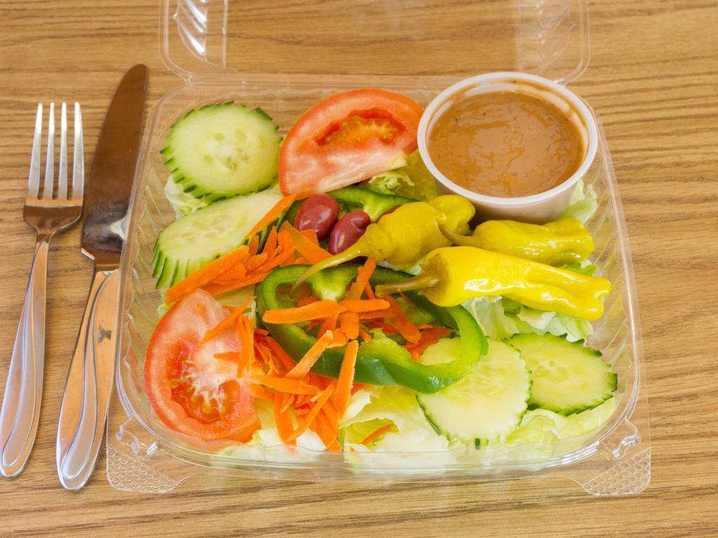 Garden Salad  · Iceberg lettuce, tomatoes, carrots, cucumber and green peppers,peppercini and olive calamata.