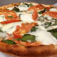 The Florentine Pizza · Spinach, tomatoes, garlic and ricotta cheese.