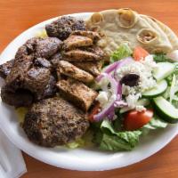 Mix Kabob Sampler Plate · Mixed chicken kabob, lamb kabob and kofta kabob over rice with a side Greek salad, homemade ...