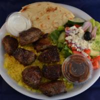 Lamb Shish Kabob Plate · Served over rice with a side Greek salad, pita and homemade tzatziki sauce.