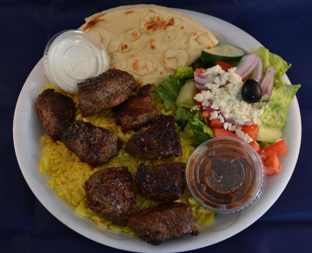 Lamb Shish Kabob Plate · Served over rice with a side Greek salad, pita and homemade tzatziki sauce.
