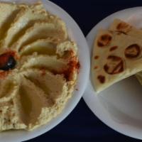 Hummus (Vegan) · Homemade ground chickpea spread. Served with pita bread.